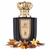 Frasco Shaula de Nojoum Dubai EDP, botella rectangular negra brillante con placa dorada grande y borde punteado, caligrafía árabe شولا y texto SHAULA NOJOUM DUBAI en oscuro, cuello dorado acanalado, tapa corona real ornamentada en oro brillante, rodeado de hoja de tabaco, jengibre, especias, tonka, flor de tabaco, vainilla, cacao, frutas secas y maderas.
