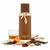 Frasco de perfume Vulcan Sable, botella rectangular marrón chocolate oscuro mate con escultura de serpiente dorada enroscada en el cuello con ojos rojos, tapón cilíndrico marrón texturizado y anillo base dorado, sobre fondo blanco, rodeado de whisky, cilantro, mandarina, sésamo, anís, cacao, sándalo, cachemira, haba tonka, benjuí, styrax, cedro blanco, pachulí y vainilla.