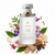 Frasco Golden Hour de Liwan EDP, botella cilíndrica alta en vidrio esmerilado blanco con acanalado vertical profundo, logo monograma LI dorado pequeño, texto dorado LIWAN GOLDEN HOUR, banda collar multi-anillo dorado prominente en la parte superior del cuerpo, cuello dorado corto, tapa cilíndrica ancha blanca mate con anillo dorado en la base, rodeado de pimienta rosa, notas verdes, violeta, orquídea, cedro, pachulí, sándalo, cashmeran, tonka y ambroxan.
