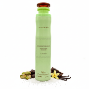 Spray ambientador Lattafa Decadent Delights Choco Pista Macaron 300ml, lata aerosol cilíndrica alta verde pistacho pastel con curvas reloj de arena, texto árabe marrón oscuro ملطف جو, bandas ornamentales, texto marrón oscuro DECADENT DELIGHTS CHOCO PISTA MACARON Lattafa Air Freshener 300 ML, tapa disco redondo ámbar-marrón, rodeado de pistachos, chocolate oscuro, vainilla y azúcar.