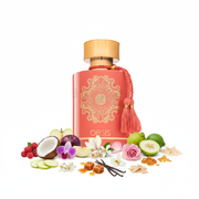 Frasco de perfume Oasis EDP, botella rectangular redondeada coral-rosa mate con gran mandala de nudo céltico dorado en relieve, texto dorado OASIS sobre banda dorada, borla decorativa coral con anillos dorados en el lateral derecho, tapón cilíndrico plano dorado cálido, sobre fondo blanco, rodeado de bayas silvestres, coco, manzana verde, ciruela, orquídea, magnolia, jazmín, rosa búlgara, bergamota, caramelo, vainilla, almizcle, benjuí, ámbar y sándalo.